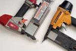 Bostitch's and Max's magazines hold nails in when the slide is open. Bostitch uses a magnet, while the Max has a two-stage door.
