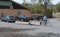 Proper balancing of the load is critical when carrying long pieces of dimension lumber, notes Walter. Here a bundle of shingles strapped to the front of the load provides just the right amount of tongue weight.