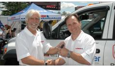 Sweepstakes winner Larry Allar (right) accepts the Site Commander keys from Tools of the Trade editor Rick Schwolsky.