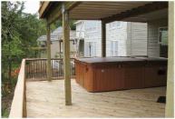 A hot tub weighing 3 tons when full added to the challenge of building an airy deck.