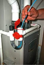 A clear bend and access ports make this condensate trap easy to inspect and clean.