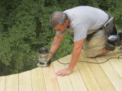 Easing the edges and ends of the decking with a 1/2-inch-diameter round-over bit helps prevent splinters from forming, while a final sanding removes mill marks. As soon as possible after completion, the author will seal the deck with a penetrating stain or water-repellent finish.
