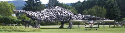 At 122 feet long and about 25 feet high, Vermontasaurus is substantially larger than most real dinosaurs. Its “backbone” is a roof truss salvaged from a building collapsed by heavy snow. Also included in its bulk are window frames, broken furniture, an old toboggan, a smashed acoustic guitar, and at least three nests built by local birds.