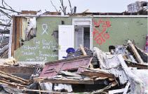 The wreckage of this home, in the aftermath of a tornado that struck Tuscaloosa, Ala., on April 27, demonstrates the tendency of some interior rooms to remain largely intact even when the rest of a structure has been demolished.