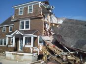 The intact addition shown above withstood Sandy's storm surge on the beach at Mantaloking, N.J. The original house was undermined by scouring and collapsed.