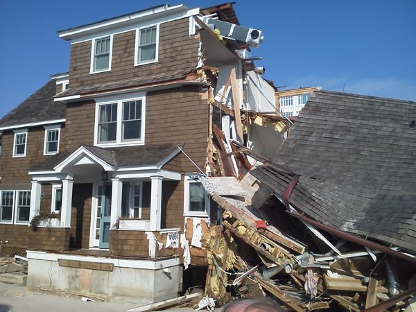The intact addition shown above withstood Sandy's storm surge on the beach at Mantaloking, N.J. The original house was undermined by scouring and collapsed.