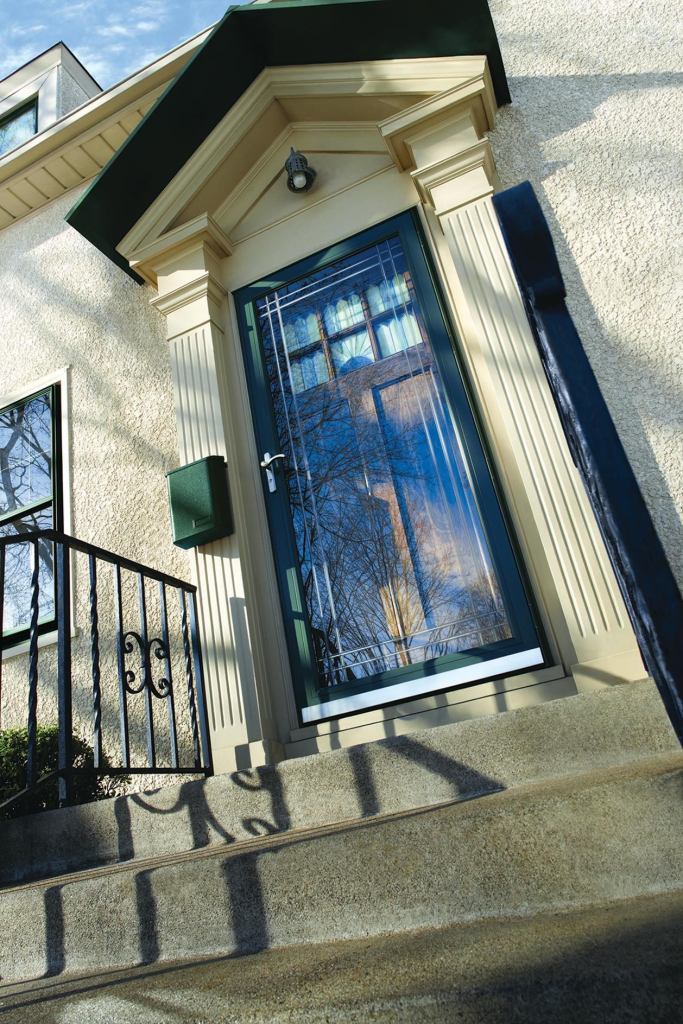 Contemporary Series Storm Door in Forest Green with Nickle Hardware and Etched Glass. Angle shot.