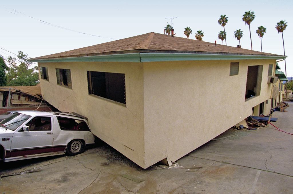 In an earthquake, shear walls help upper stories stay connected to the foundation, which moves rapidly back and forth. Without them, the movement gets too far out of sync, and the building “pancakes,” as in this 1994 photo from Northridge, Calif.