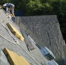 Some roofers install underlayment vertically over short steep roof decks to provide quicker protection from the weather, but not all building inspectors will approve this practice. In general, the IRC specifies horizontal underlayment installation.