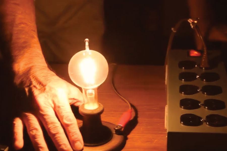 New Jersey manufacturer Larry Birnbaum switches on a treasured bulb presented to his grandfather, Samuel, by Thomas Edison in 1914.