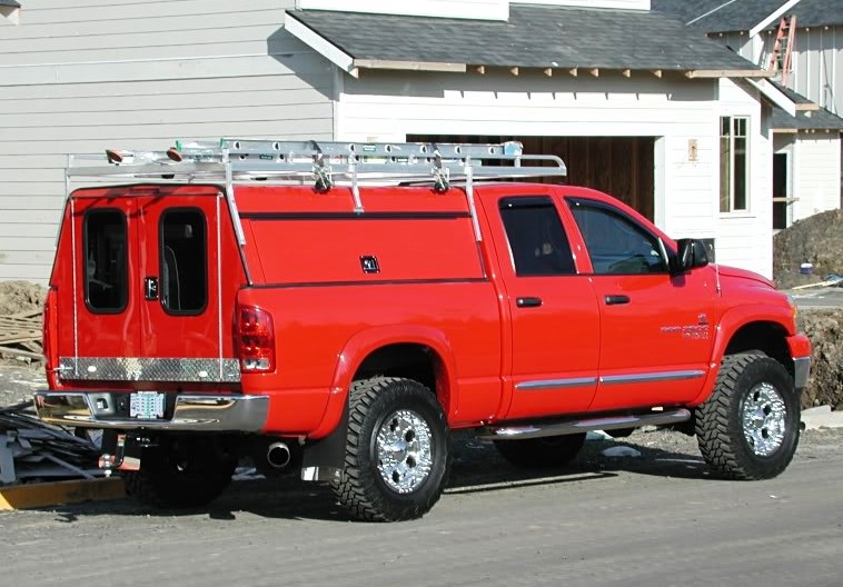 The truck is 2006 Dodge 2500 with a rack and a custom cap.