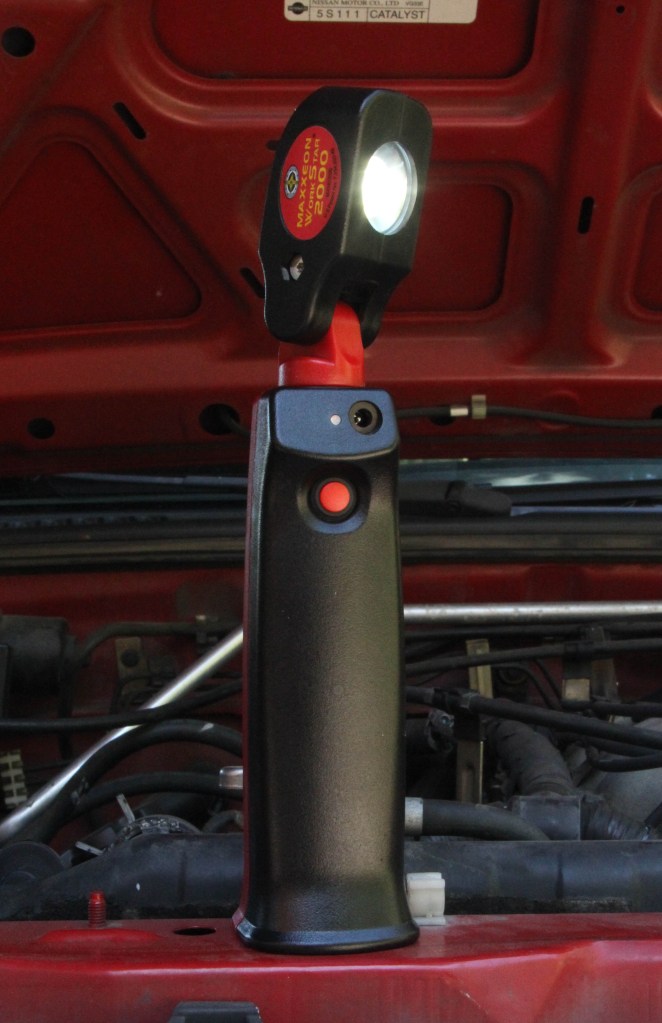 The work light will stand in the upright position or can be attached (from the bottom ) to a tripod or anything else with a 1/4 x 20 thread.