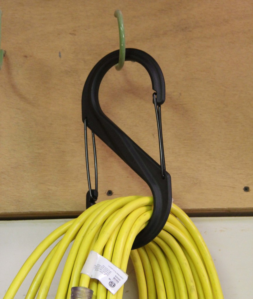 The #10 S-Biner is about 10" long and is rated to hold 100 pounds. This is the largest model currently available and probably the best for hanging hoses and cords.