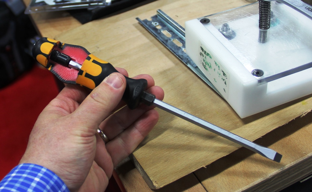 The handle of this screwdriver was cut away to show how the shaft goes all the way through to the metal cap at the end. This allows the user to beat on the handle without fear of breaking the handle.