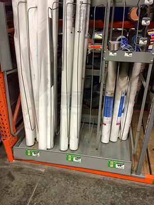 Identical looking rolls of white housewrap, but vastly different prices
