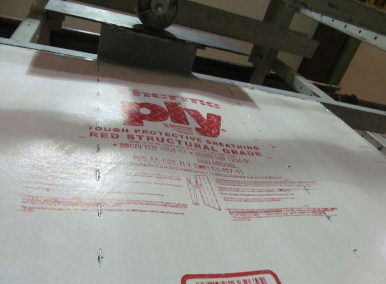 Buckling between studs of ThermoPly Red during APA tests to evaluate the panel product's shear resistance