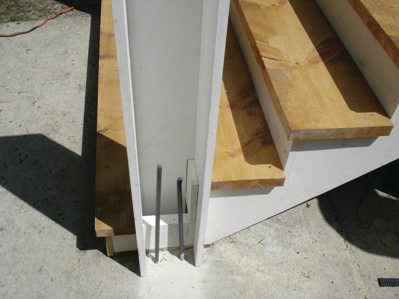 Here the concrete-filled post will be tied to an existing concrete pad.