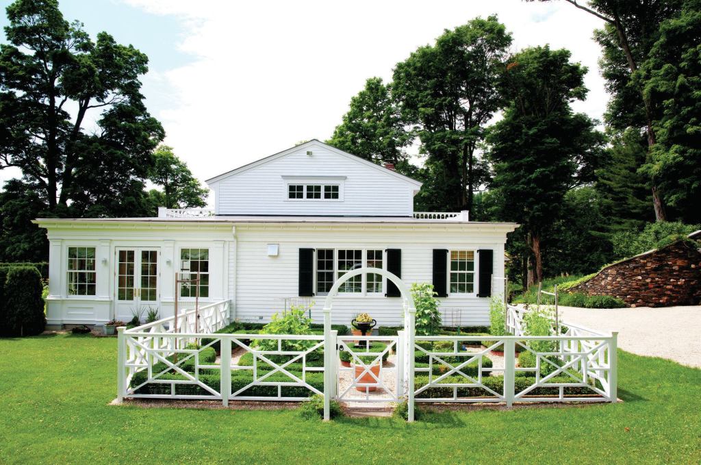 The existing red-cedar garden fence had started deteriorating after about 12 years. To build its more durable replacement, the author provided drainage for the new posts and used a mix of materials.