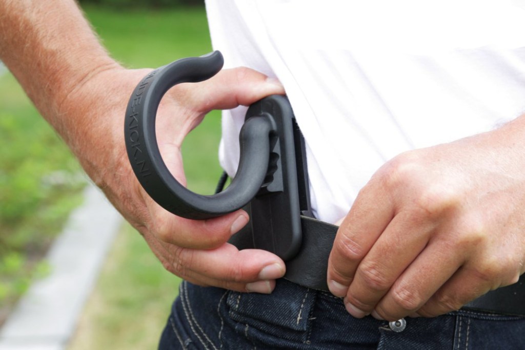 Slide-Kick hose and cord holder