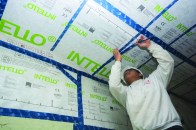 A technician for J’s Custom Contracting installs Intello smart vapor barrier on the ceiling under the low-slope roof of a Brooklyn, N.Y., row house. Flat roofs, which are tricky to vent, are one case where smart membranes can be problem solvers.