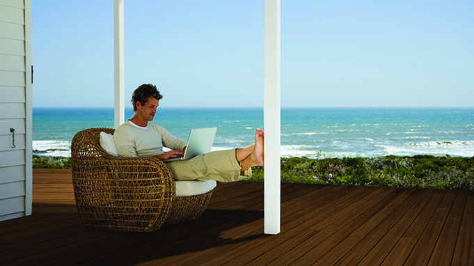 Man using laptop computer outdoors