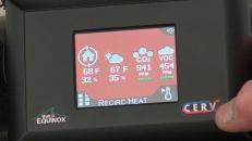 A close-up of the remote-control display for the Build Equinox shows readouts for temperature, humidity, carbon dioxide, and volatile organic compounds. The CERV's "black box" sensor and control system continously monitors CO2 levels, VOC levels, and temperature in the occupied rooms, and implements air exchange as needed to keep air quality within parameters selected by the occupant.