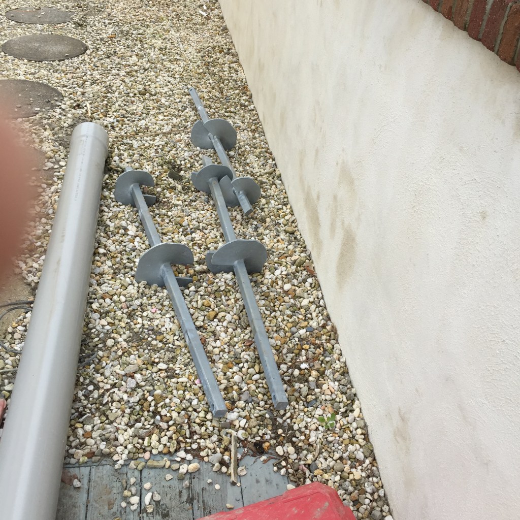 Helical piers are like giant screws that are driven into the ground to a specified depth to achieve the proper bearing capacity. Helical piers come in 4-ft. sections that make it easier to drive them in more compact spaces.