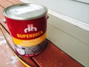 Instead of using a traditional stain, the author chose to refinish the decking with an elastomeric coating, which is characterized by a high solids content.
