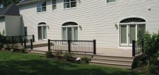 The old wood railing was replaced with TimberTech's RadianceRail composite deck rail.