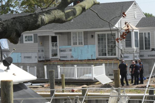 Two workers were injured, one seriously, when a deck they were working on collapsed in Copiague, New York. Credit: Paul Mazza/Newsday