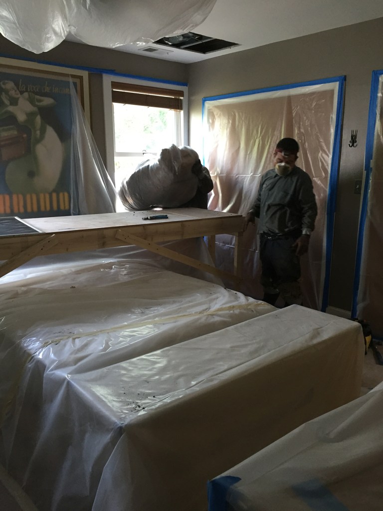 Energy retrofit remodelers at work in my bedroom.