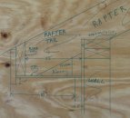 To help measure and visualize the eaves components, a full-size drawing is done. This drawing provides dimensions and distances for all of the parts. The rafter jig seen in the next photo helps with the layout.