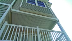 One of the condo owners discovered water  pouring out of the aluminum capping that covered a beam above his second-floor balcony.
