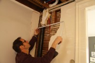 A drain pipe that had been relocated into the wall cavity couldn’t be pushed back far enough and stuck out beyond the plane of the existing plaster surface.
