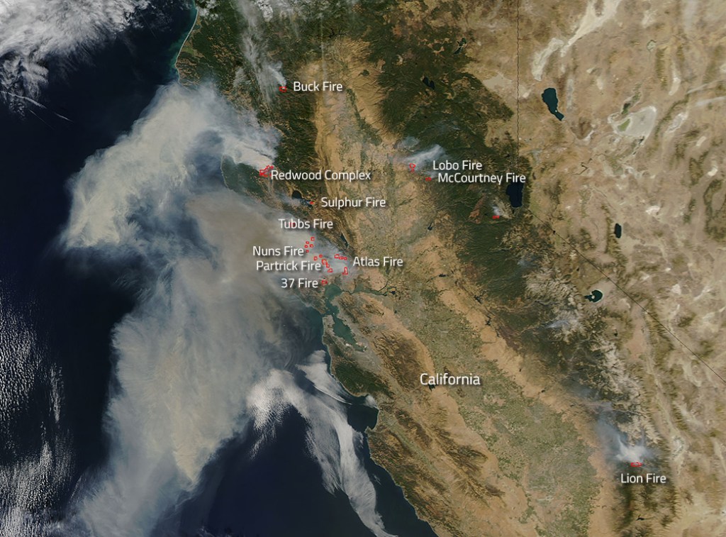 Smoke from California wildfires blows out over the Pacific Ocean in this NASA satellite view.