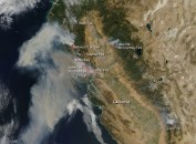 Smoke from California wildfires blows out over the Pacific Ocean in this NASA satellite view.
