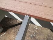 Imus Cap is a paintable metal top layer bonded to wood joists and beams with a peel-and-stick waterproof adhesive.