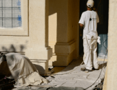 New Life Home Improvement worker using dropcloths while painting