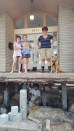 Top: Pam Shefman, daughter Quinn, friend Yeal, and dog Sandy stand on the slab of the Shefman home as the house is elevated at the last minute, days before Hurricane Harvey flooded the location with five feet of water. Below, crew from Texas-based Arkitektura places a concrete grade beam for the home's new foundation. Bottom, a deposit of debris at the high-water mark after floodwaters receded confirms how close the home came to being flooded for a third time. (Photos Courtesy Drew Shefman)
