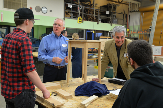 REMODELING Editor-in-Chief Craig Webb (second from right) and Tum-A-Lum Lumber CEO Dave Dittmer (second from left), chat with Wood Shop students at Hood River Valley (Ore.) High School.