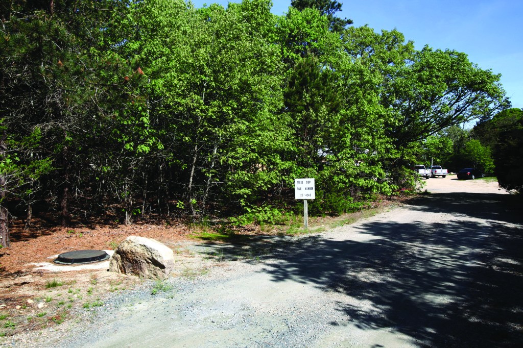 The well had to be located a minimum of 100 feet from any septic system, so the well pit (in the lower left corner of the photo), is barely visible from the house.