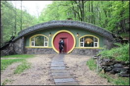 Above is the Hobbit home’s front facade. Built to Passive House standards, the home’s features include low air infiltration; super-insulated walls, roof, and floor; high-performance windows and exterior doors; energy recovery ventilation; and ADA accessibility (inside and out).