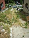 If you were to climb this dilapidated driveway and walk up the stairs that begin at the left side of the photo, you would come to a house surrounded by several level staging areas. The driveway and stairs obviously affect access. But they won’t impact access for all items of work in a renovation of the house; they will do so primarily for set-up and breakdown and (especially) for material delivery. But once the jobsite is set up each day and material is in place and handy for installation, access will be just as it would be on a gently sloping lot. Therefore, when the costs of a renovation are estimated, they need to be modified upward for setup, delivery, and other work that involves climbing the drive and stairs. But they will not need to be modified for the installation of items in the project. Figuring that out is not art; it’s estimating.