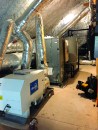 Above, an Ultra-Aire 155H dehumidifier sits next to the air handler of a 6-ton geothermal heat pump, part of a wholehouse climate-control system designed by Austin-based Positive Energy. The unit can remove as much as 155 pints of water at 7 pints per kWh and can effectively dehumidify air as cool as 56°F, according to Ultra-Aire specifications.