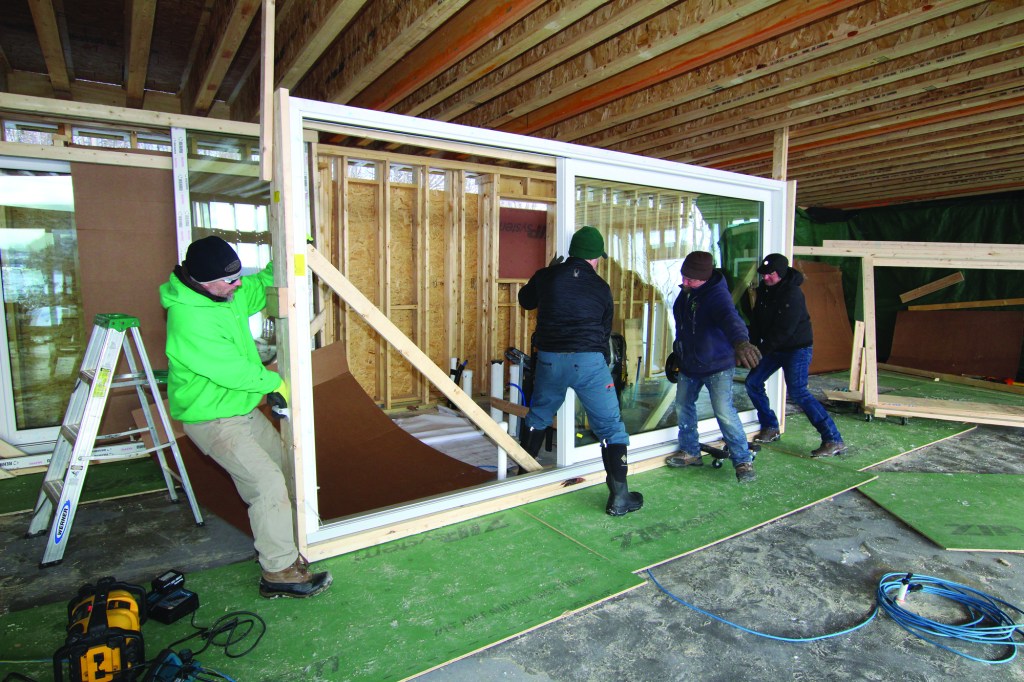 The doors weighed about 750 pounds apiece without the slider, and more like 950 pounds with it.