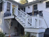 The original deck acted as a porch roof for a ground-level entry to the home, and had been waterproofed with an EPDM membrane laid over plywood sheathing.