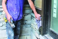 With a porous stone like bluestone, the process of spalling (also called “thermalling” or “flaming”) can be used to rough up smooth-cut surfaces. First the stone is thoroughly wetted.