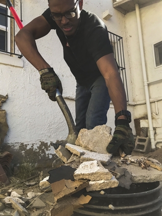 Ongoing work: Cleaning up a homeowner's mess.