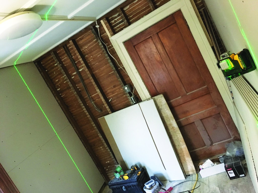 The author illuminates premarked stud locations by rotating the laser to each stud. No more marking the wallboard with level and pencil to minimize misses.