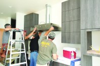 The restaurant-grade vent hood for this custom home pulls 600 cfm from the kitchen.